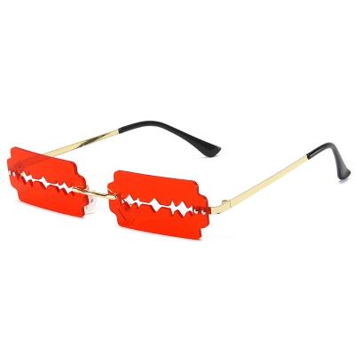 China New Fashion Sun Glass Personality Halloween Rectangle Frameless Hollow Blade Frameless Sunglasses Women Small Rimless for sale