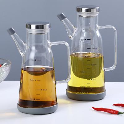 China Factory Direct Heatable Thick Glass Cruet With Stain Steel Lid Top Borosilicate Olive Oil Frying Oil Glass Bottle Glass Jar for sale