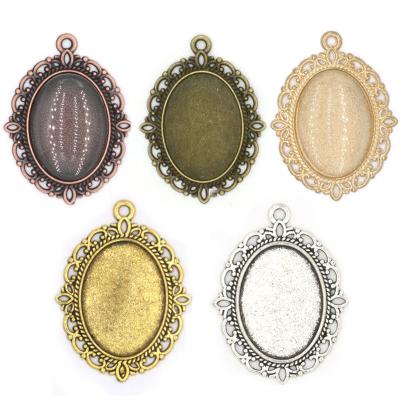 China CLASSIC 25*18mm DIY shape oval cabochon blank diy photo bezel pendant charms for jewelry making for sale