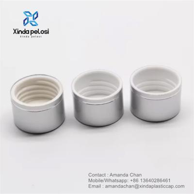 China Custom Aluminio Plata PP plástico Capo de cubierta de tornillo para botella de embalaje cosmético en venta