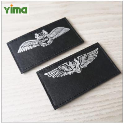 China Viable Custom Apparel Accessories Label Leather Label With Logo Faux Leather Embossed Soft Fold Garment Label for sale