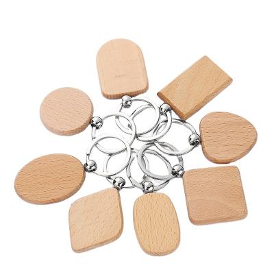 China Fast Shipping Custom Wood Can Laser Engrave Small Gift Beech Key Chain Logo Wooden Pendants for sale