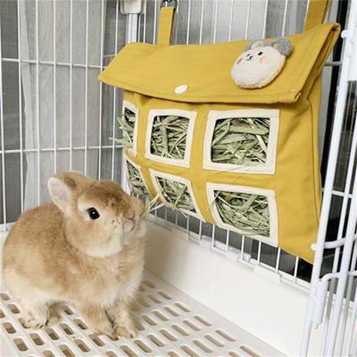 China High Quality Viable Canvas Two Hole Rabbit Feeder Bags Guinea Pig Hamster Small Pet Hanging Hay Snack Feeder Bag for sale