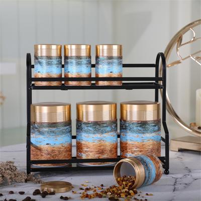 China Amber Wholesale Viable Colored Ceramic Marble Jar With Lid Porcelain Canister With Lid And AL Metal Holder for sale