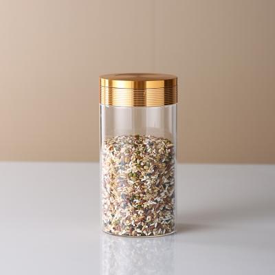 China Home Use Empty Round Glass Canisters Kitchen Use Aluminum Lids Clear Glass Storage Bottles And Jars Food Canister for sale