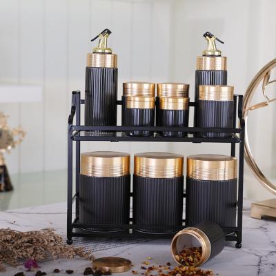 China Sustainable Kitchen Olive Oil Vinegar Dispenser Bottle Sugar Salt Pot Set Ceramic Kitchen Coffee Canister Sets With Metal Rack for sale