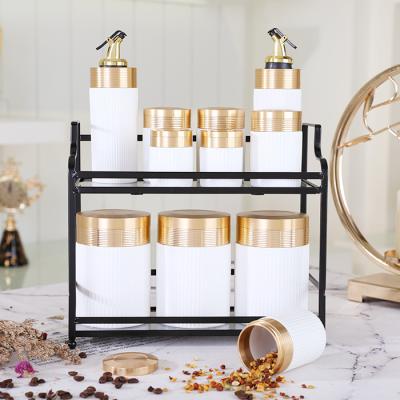 China White Ceramic Canisters Kitchen Storage Canisters Sugar Coffee Tea Cookies Kitchen Accessories Viable Containers Bottles With Gold Lid for sale