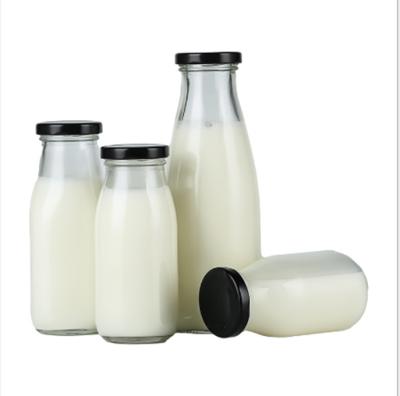 China 250ml Transparent Glass Beverage Bottle For Juice Milk And Soy Milk Or Other Beverage With Metal Caps for sale