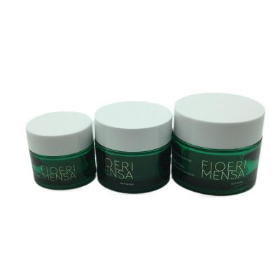 China Luxury Custom Green Cosmetics Logo 15g 30g 50g Glass Jars With Cap With White Lid for sale