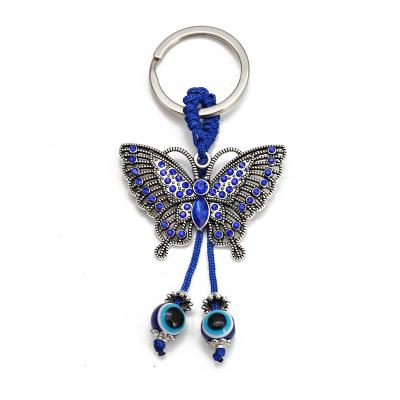 China High Quality Creative Novelty Blue Eyes Metal Wholesale Lucky Elephant Pendant Keychain Fun Key Chain for sale