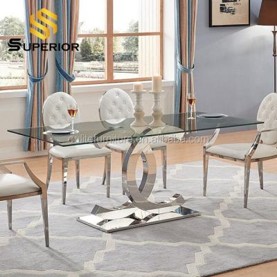 China Transparent disassembly and mirror glass dining tables and chairs set metal frame home restaurant furniture for sale