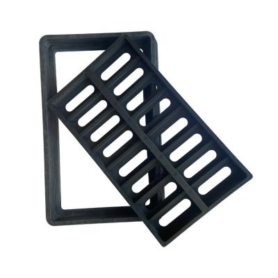 China Long Lasting Black Composite Sewer Manhole Cover Gutter Grating Water Rain Gutter Grating With Frame for sale