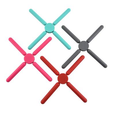 China Durable Heat Resistant Mat Foldable Silicone Trivets Silicone Coaster Table Tripod for sale