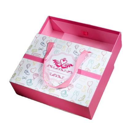 China Recyclable Custom Soft Cardboard Gift Box Slide Drawer Cosmetic Packaging Box With Ribbon Handle for sale