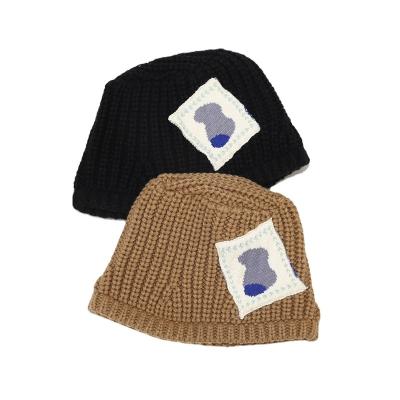 China Fashion Winter Hat Patch Knitted Hat With Manual Yarn Hanging Thick Thermal Bucket Hat for sale