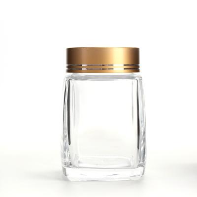 China 280ml canned food wide mouth honey glass jar with tinplate cover for jam honey food packaging for sale