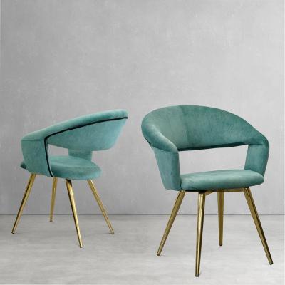 China High Grade Convertible Blue Velvet Modern Dining Chair Simple Design Curved Hollow Back Upholstered Dining Chair With Gold Leg Frame for sale