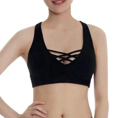 China Cavity Black Workout Breathable Front Sports Bra Strappy For Women Seamless Sports Bra Yoga Bra for sale