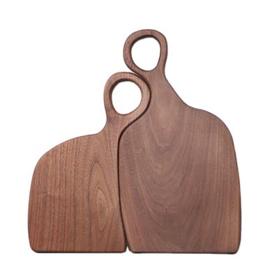 China Kitchenware Sustainable Gift Decorative Black Walnut Couples Wooden Chopper Cutting Board for sale