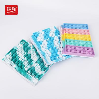 China Financial Institutions Manufacturer Hot Sale New Design Multi Color Push Anti-stress Notepad Silicone Snap Cover Jumping Notebook For Office School for sale