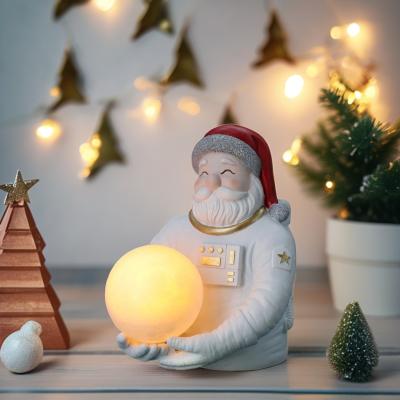 China Add a Festive Glow Modern Resin Astronaut and Santa Claus Night Lights for Christmas Decor for sale