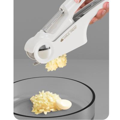 China Stocked Hand Vegetable Slicer 4-in-1 Garlic Press Kit with Heavy Duty Garlic Crusher for sale