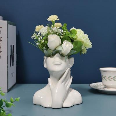 China Super Markets Under Glazed Modern Nordic White Ceramic Female Face Shaped Flower Vase for sale