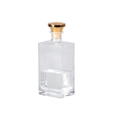 China Spirits Square Glass Spirits Bottle Embossed Logo Bottles For Brandy Liquor for sale