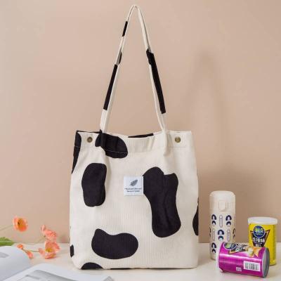 China YIMYIK Best-price Tote Bag Simple Cow Printing Handled Corduroy Portable Women's Shopping Bag for sale