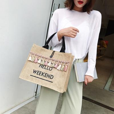 China Other capacity custom large tassel logo linen weave letter printing women ethnic fasion handbag packaging for sale