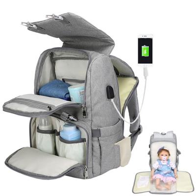 China 2021 new fashion backpack fashion changing caring usb mom dad mom dad diaper pad bag waterproof travel bag large capacity for sale