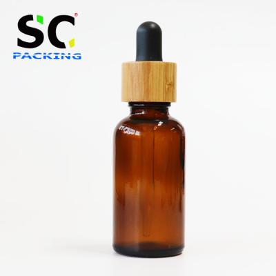 China Pharmaceutical Have Stock Wholesale Essential Oil 30ml Amber Glass Dropper Bottle With Bamboo Lid for sale