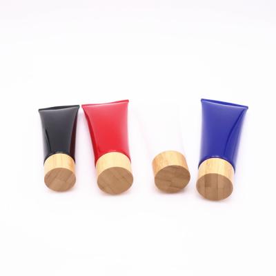 China High quality hot sale cosmetic empty cosmetic plastic tube with bamboo cover refillable cosmetics tube for sale