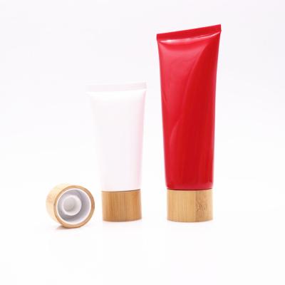 China Eco-friendly Cosmetic Tube Packaging Matte Green Plastic Squeeze Tube With Bamboo Screw Lid for sale