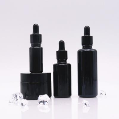 China Violet 10ml 15ml 30ml 50ml 100ml Dropper Bottle Cosmetic Black Round Glass Essential Oil Bottle for sale