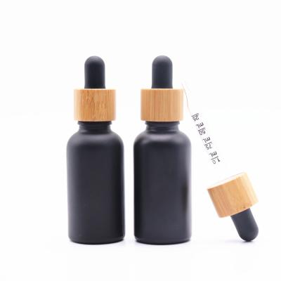 China Custom Black Essential Oil Cosmetic Glass Dropper Bottle 5ml 10ml 20ml 30ml 50ml Black Bottle With Dropper Cap for sale