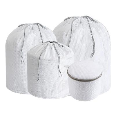 China Large Mesh Cloth Fabric Laundry Bag Foldable Strong Drawstring Eyelet Laundry Bag Heavy Duty Laundry Bags Customize for sale