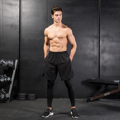 China Breathable Quick Dry Pants Gym Wear Pockets Soft Running Gaiters Male Workout Jogging Pants For Men for sale