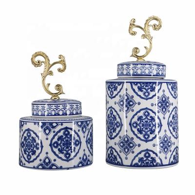 China Viable Chinese Ceramic Blue And White Pattern Heart Peach Jar With Metal Outer Cover For Home Decor for sale