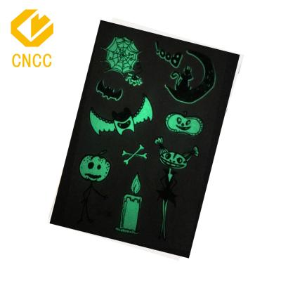 China Temporary Water Transfer Halloween Kids Tattoo Sticker Black Printing Glow In The Dark Cartoon Adult Face Body Tattoo Stickers for sale