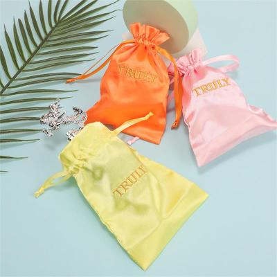 China Custom Logo Dustproof Storage Orange Reusable Gift Packaging Bags Satin Inside for sale