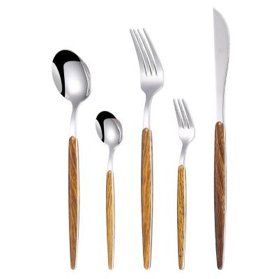 China Viable bulk forks silver spoon knife and spoons cubiertos metal Portugal cutlery with pattern wooden handle for sale