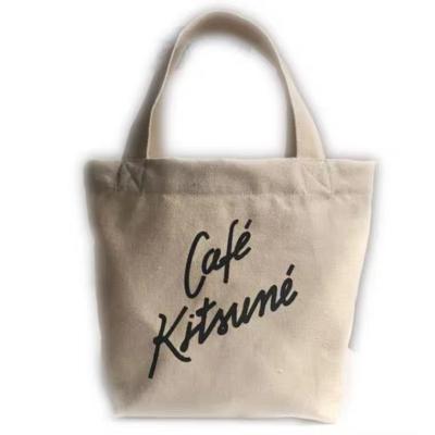 China Reusable wholesale cotton canvas tote bag kawaii bags cotton printing with leather handles inside pockets for sale