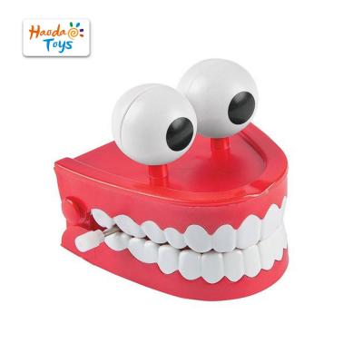 China Wonderful Gift Wind Toys Light Up Loudly Vibrating Chewing Teeth With Moving Eyes for sale