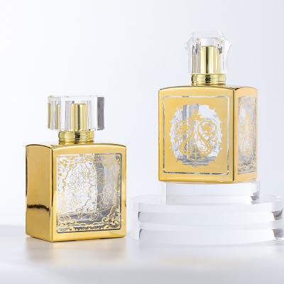 China Dubai Style Cosmetic Square Perfume Bottle 100ML Glass Perfume Bottle Golden Luxury With Box for sale