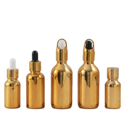 China Do you supply luxury design 10ml 15ml gold essential oil bottle gold dropper glass electroplating silver glass bottle for sale