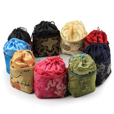 China Eco-Friendly Jewelry Pouches Wedding Christmas Party Favors Packing Silk Bags With Bell Decor Flower Pouch for sale