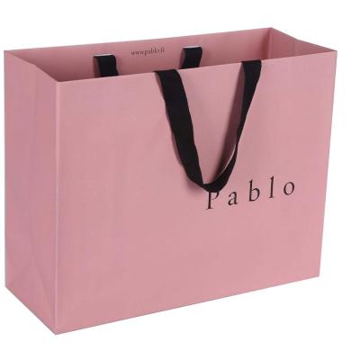 China Pink Luxury Environmentally Friendly Paper Shopping Bag From China Recyclable Paper Bag Manufacturer With Custom Logo for sale