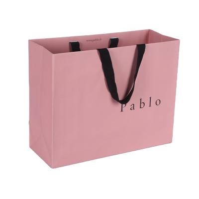 China Low Moq Recyclable Custom Luxury Paper Clothing Packaging Gift Shopping Bag With Branded Logo for sale