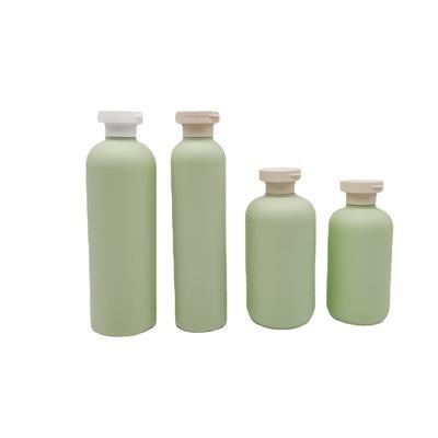 China Custom Empty Personal Care 300ML 10OZ PET Bottle Green Color Frosted Outer Squeeze Shampoo Bottle With Flip Top Cap for sale